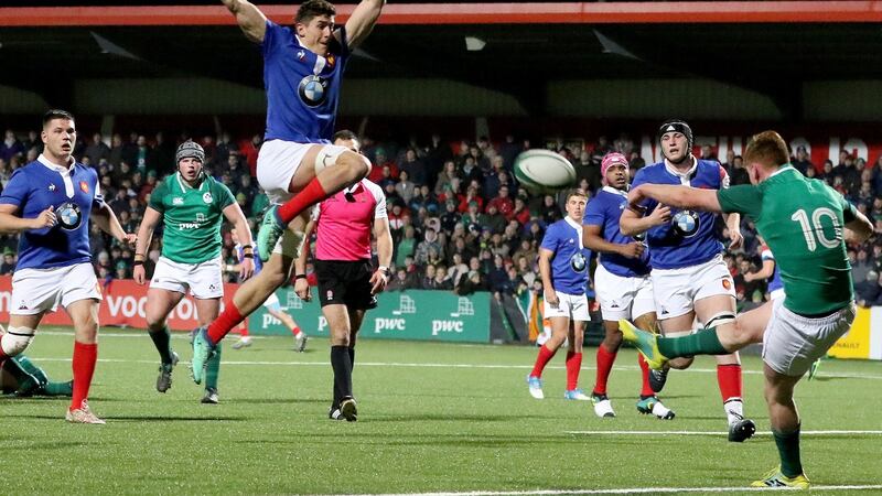 France’s flanker Paul Boudehent tries to charge down Ireland outhalf Ben Healy. Photograph: Paul Faith/AFP/Getty/