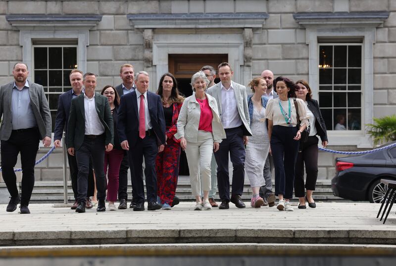 Catherine Connolly with supporters as she launches her presidential bid outside the Dáil on Wednesday. Photograph: Alan Betson

