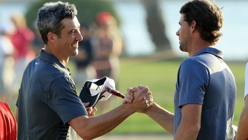 Joint leaders Ross Fisher and Thomas Pieters shake hands at the end of the third round. They will partner each other again in the final group for Sunday’s final round. Photo: Andrew Redington/Getty Images