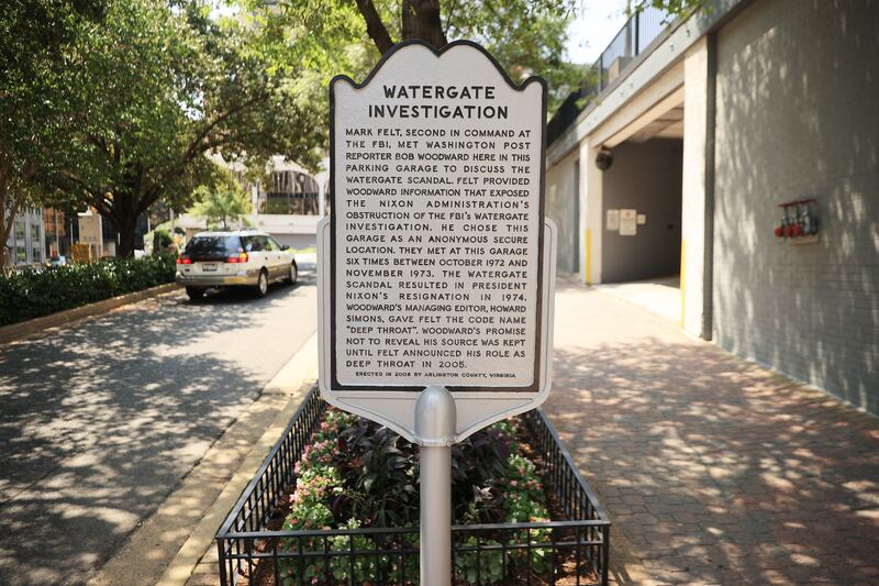 A historical marker stands outside the parking garage  where Washington Post reporter Bob Woodward would meet his source, Mark Felt, or "Deep Throat", to exchange notes about the Watergate scandal. Photograph: Chip Somodevilla/Getty Images
