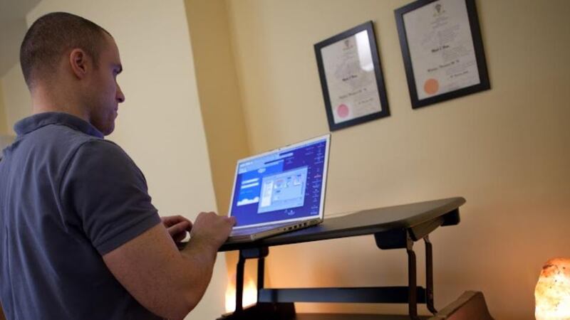 Mark O’Brien of Fit Plus Well using a Varidesk