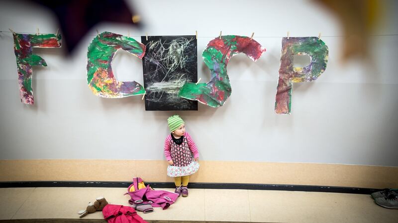 At the child care program, children painted the soccer club’s letters. Photo: Gordon Welters/The New York Times