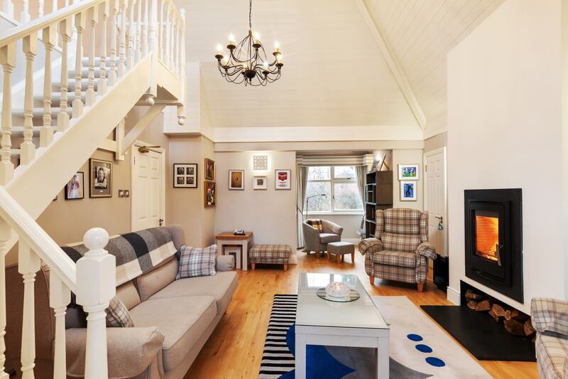 A large high-ceilinged family room could be an au pair or guest quarters, a teenagers’ hideout or a place busy parents might escape to.