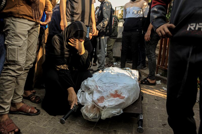 A victim of an Israeli air strike in Khan Younis. Photograph: Yousef Masoud/The New York Times
                      