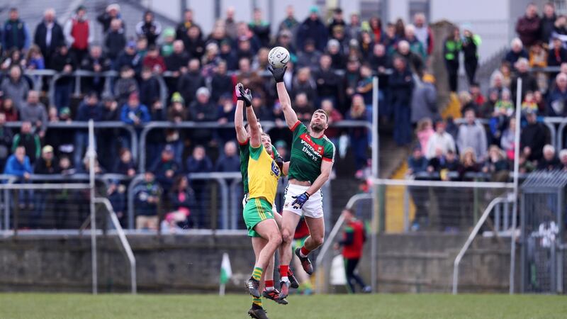 Mayo’s Séamus O’Shea gets to the ball ahead of Donegal’s Michael Murphy during the Allianz Football League Division One game at MacCumhaill Park in Ballybofey. Photograph: Tommy Dickson/Inpho