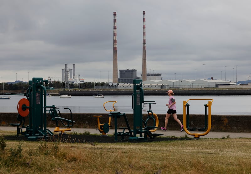 A walker on the seafront at Clontarf.  Photograph: Alan Betson/The Irish Times

