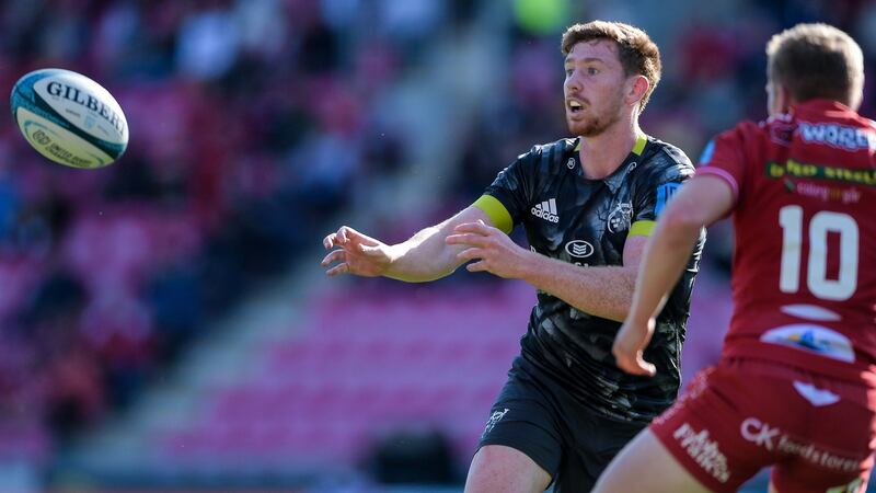 Munster’s Ben Healy comes up against Sam Costelow of Scarlets in their URC match at Parc y Scarlets in Wales on Sunday. Photograph: Ryan Hiscott/Inpho