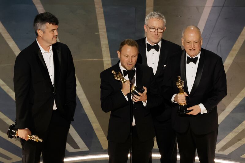 Richard Baneham (centre) accepts the best visual effects award for Avatar: The Way of Water during the Annual Academy Awards in 2023. Photograph: Kevin Winter/Getty Images