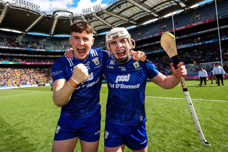 Keith Smyth and Feakle's Adam Hogan celebrate after the semi final victory over Kilkenny. Photograph: Ryan Byrne/Inpho  