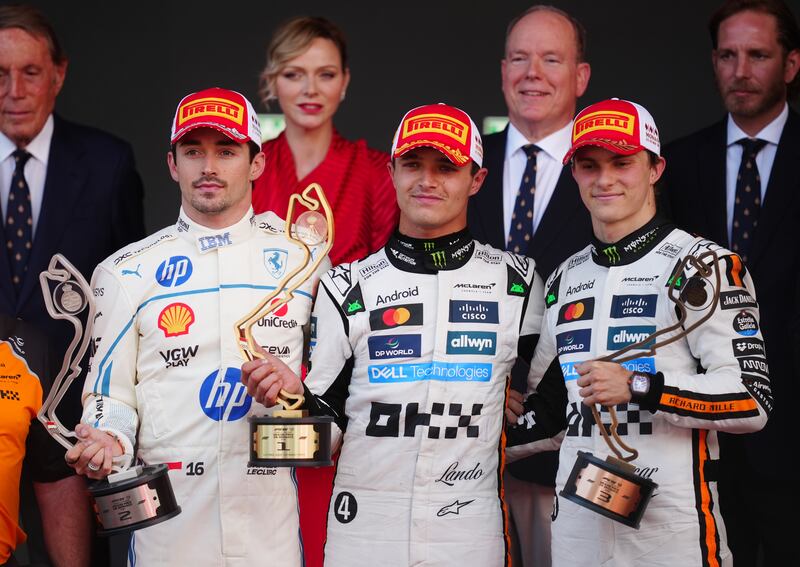 Ferrari's Charles Leclerc (second) and McLaren's Lando Norris (first) and Oscar Piastri (third) after the race. Photograph: David Davies/PA