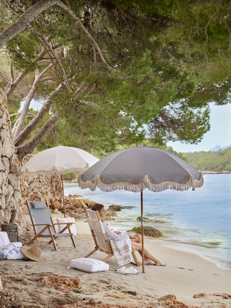 Keep cool under this fringed parasol by The White Company