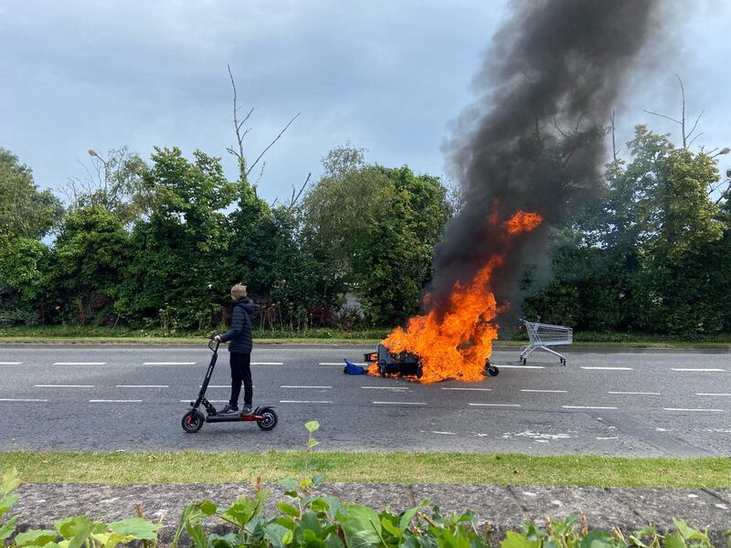 The scene outside the former Crown Paints factory in Coolock. A number of fires have been lit at the site of the former Crown Paints factory in Coolock where work was due to begin this week. Photograph: Dara Mac Donaill / The Irish Times