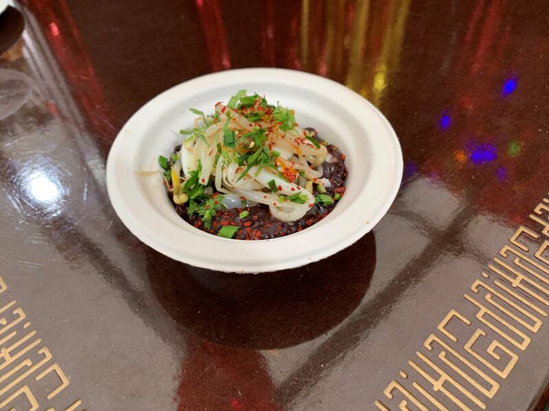 Hang Dai's braised black rice with squid and beansprout salad