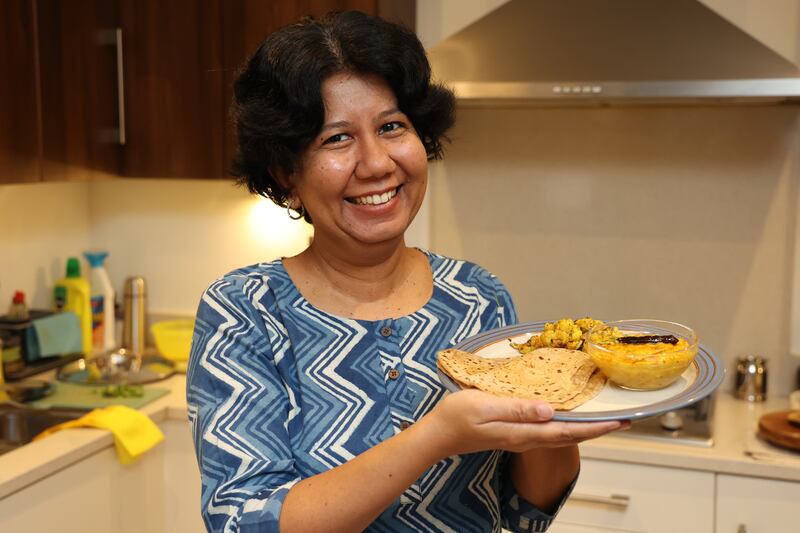 Prerna Shah with her panchratna dal (five mixed lentils), cauliflower and green peas sabzi and parathas. Photograph: Nick Bradshaw