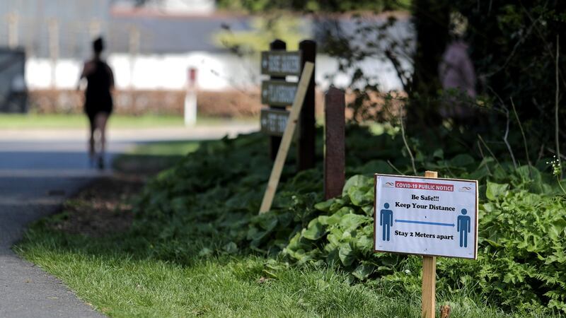 Signs reminding people to adhere to social distancing in Corkagh Park in Dublin. Photograph: Laszlo Geczo/INPHO.