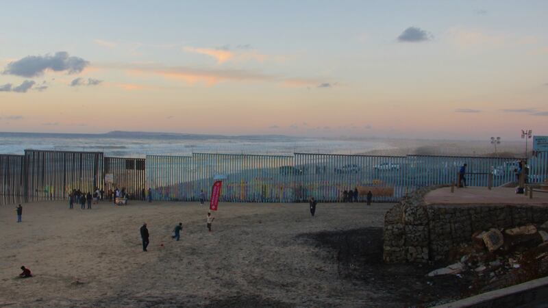 Border patrol SUVs on the US side of the border with Mexico on the shores of the Pacific Ocean. Photograph: Stephen Starr