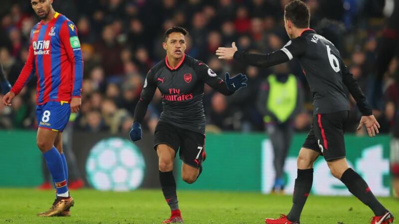 Alexis Sanchez celebrates Arsenal’s second goal against Crystal Palace with  Laurent Koscielny. Photograph: Catherine Ivill/Getty