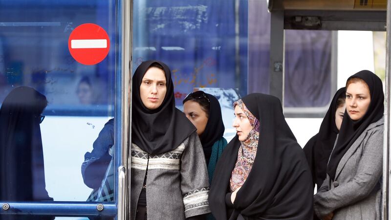 Iranian women wait for a bus at a bus station in Tehran, Iran,  November 3rd, 2018. Photograph: Abedin Taherkenareh/EPA