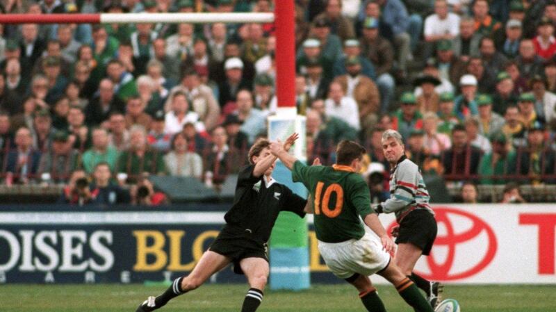 South Africa’s Joel Stransky drops a crucial goal as Andrew Mehrtens of New Zealand tries to block the effort. Photograph: Inpho/Getty Images
