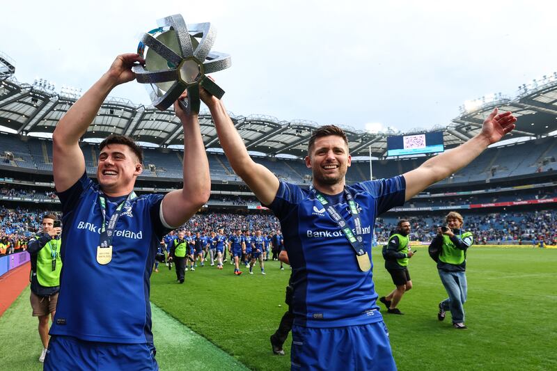 Leinster's Dan Sheehan and Ross Byrne celebrate with the URC trophy. Photograph: Ben Brady/Inpho