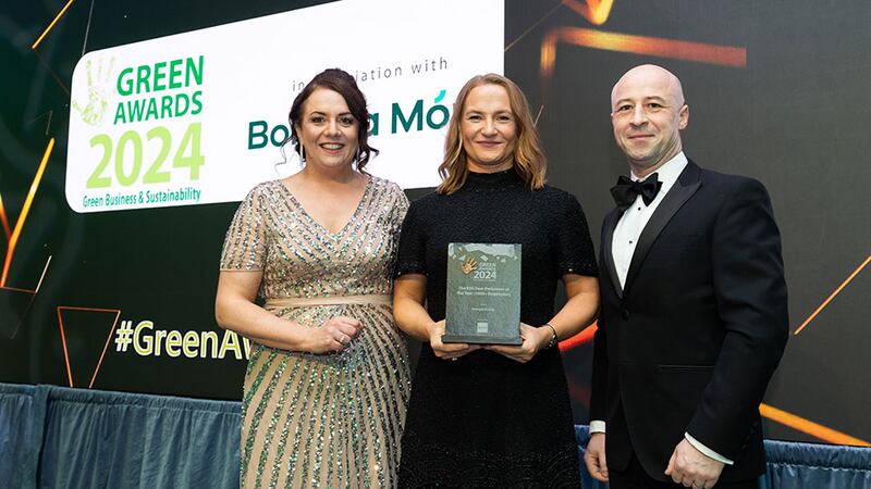 Ellie Walshe, associate director at Davy Horizons, Davy Group, presents the ESG best performer of the year (1,000+ employees) award to Annabel Fitzgerald and Derek Scully, Energia Group