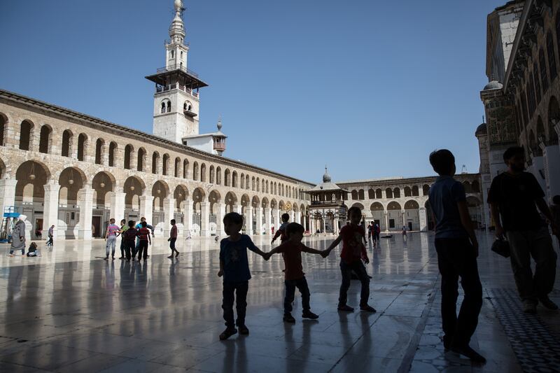 Children play in the Umayyad mosque in Damascus, from which you can still hear the regular sound of bombing in the nearby opposition-held East Ghouta and Jobar suburbs. Photograph: Sally Hayden