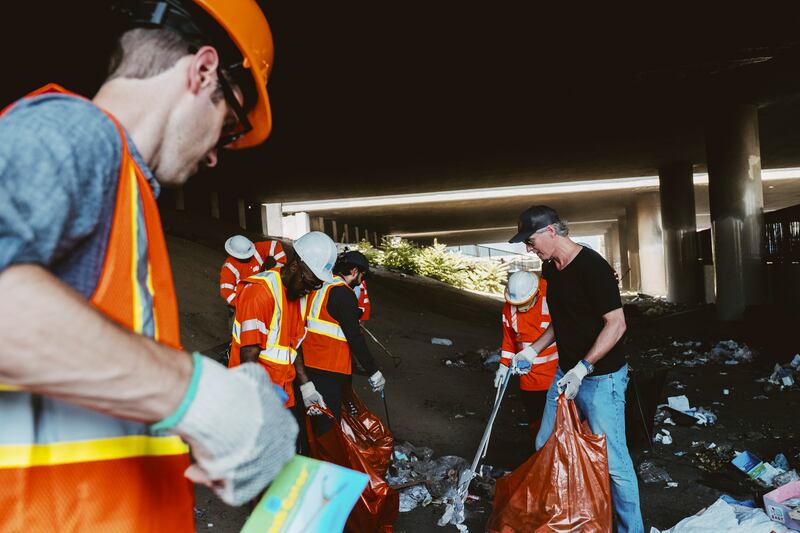 California governor Gavin Newsom (right), helps remove a homeless encampment on CalTrans property in Los Angeles earlier this month. Photograph: Mark Abramson/The New York Times
                      
