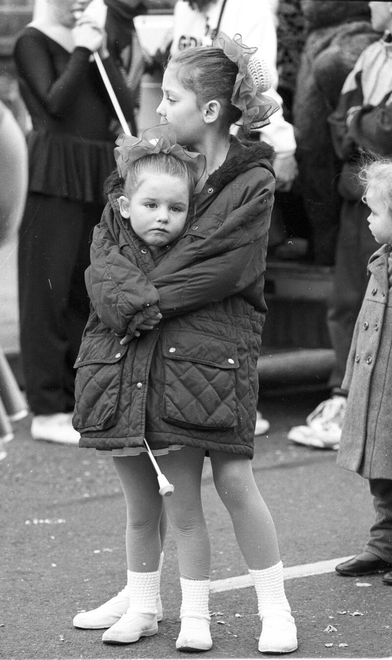 Dubliners Kelly McLoughlin and Susanne Parks keep warm during the Bread and Roses pageant on Grangegorman Road, Dublin, in October 1993. Photograph: Alan Betson