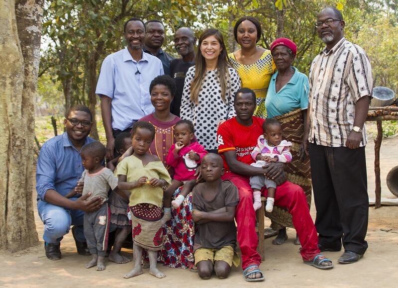 The family of Moses and Lydia Mwape, with doctors involved in the operation to separate twins Bupe and Mapalo. Taken in the village of Chabatama, northern Zambia. Photograph: Blaine Rennicks