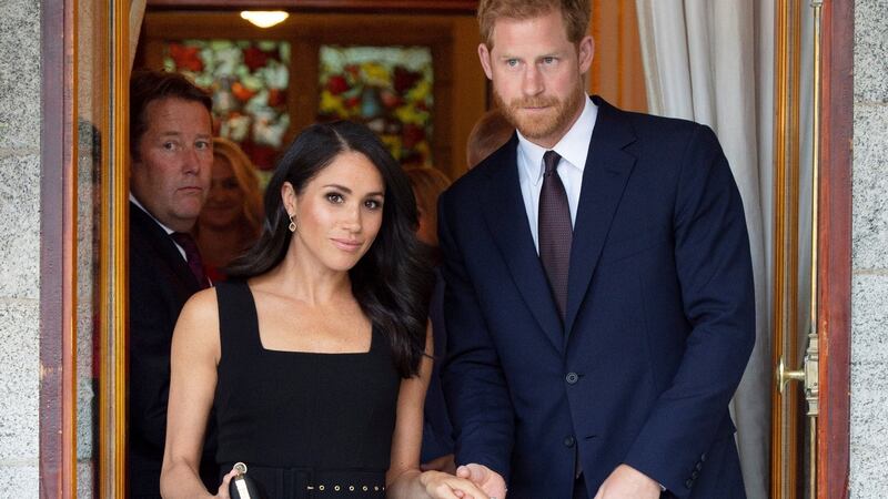 Darragh O’Brien watches the door as Harry and Meghan visit Glencairn.  Photograph: Geoff Pugh/Reuters