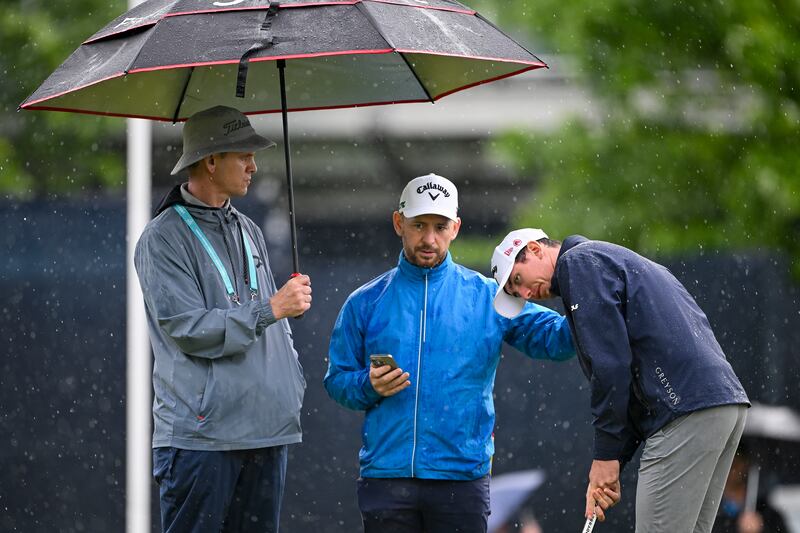 Tom McKibbin with his caddie and putting coach on the practice putting before Thursday's PGA Championship at Quail Hollow. Photograph: Ross Kinnaird/Getty Images