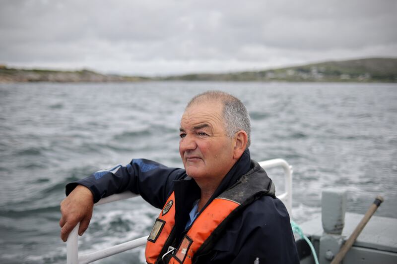 Fisherman Johnny Cloherty journeys by boat to St MacDara’s Island for Lá Fhéile Mhic Dara. Photograph: Chris Maddaloni/The Irish Times