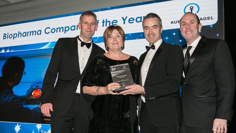 Adam O'Sullivan, Director of Pharma and Healthcare, Kuehne + Nagel Ireland presents the Biopharma Company of the Year award to the Amgen Technology Ireland