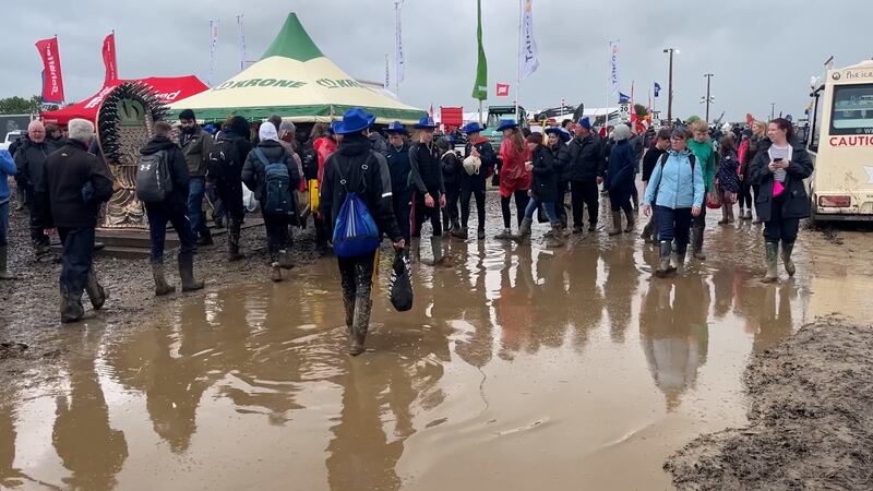 People walking through large puddles on the site on Tuesday. Photograph: Niall Carson/PA Wire 