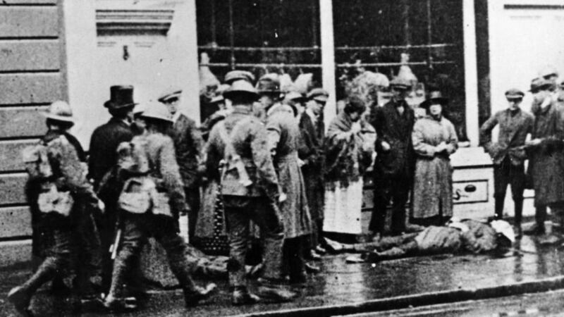 The bodies of IRA leader Sean Treacy (left) and British intelligence officer Francis Christian lie on Talbot Street, Dublin, in 1920. Photograph from ‘Revolution in Dublin: A Photographic History 1913-23’ by Liz Gillis (Mercier Press, €15.99)