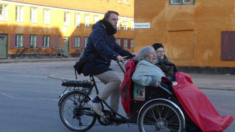 Helle, on the left, and Birthle go for a cycle with their  pilot,  Theis. Photograph: Derek Scally