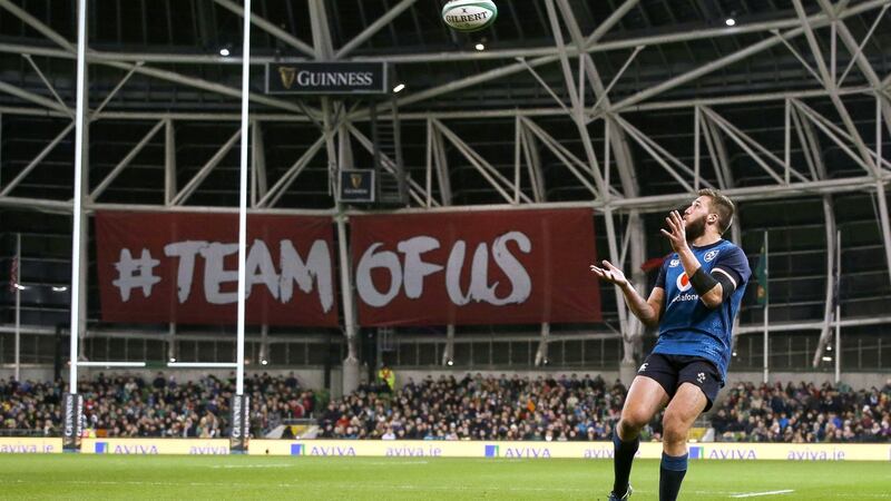 Ireland’s Stuart McCloskey gets set to take a catch on his way to scoring a try during the autumn international against the USA at the Aviva stadium. Photograph: Tommy Dickson/Inpho