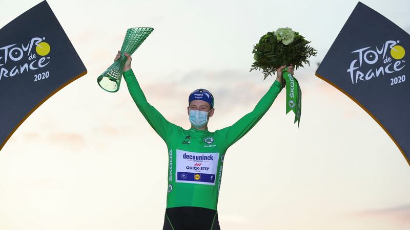 Sam Bennett on the podium after his green jersey win was confirmed. Photograph: Thibault Camus/AP