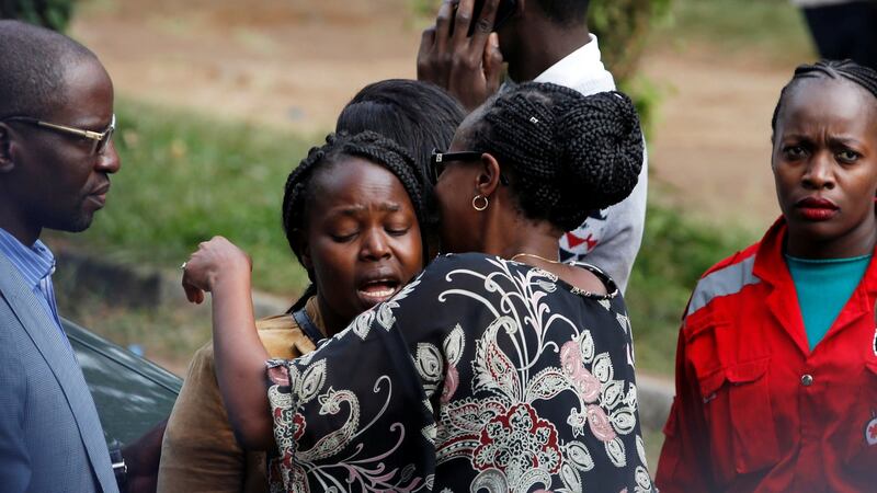 Unidentified relatives react outside the scene where explosions and gunshots were heard at the DusitD2 Hotel compound in Nairobi, Kenya. Photograph: Thomas Mukoya/Reuters.