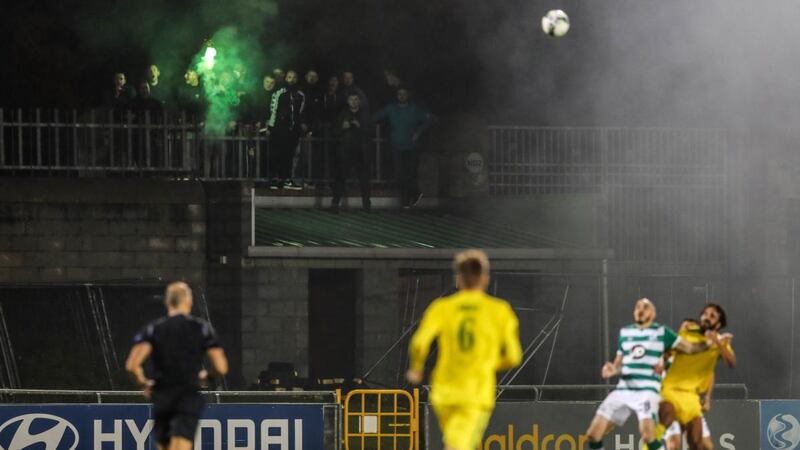 Fans look on from outside the ground during the Europa League first qualifying round between against Shamrock Rovers and Ilves Tampere at Tallaght Stadium. Photograph: Ryan Byrne/Inpho