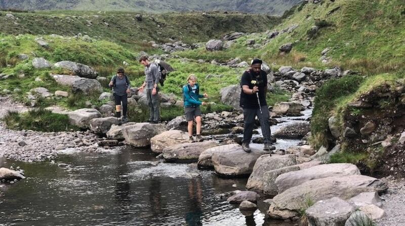 Eoghan O’Kelly leading retreat visitors from New York through the Co Clare countryside on an excursion