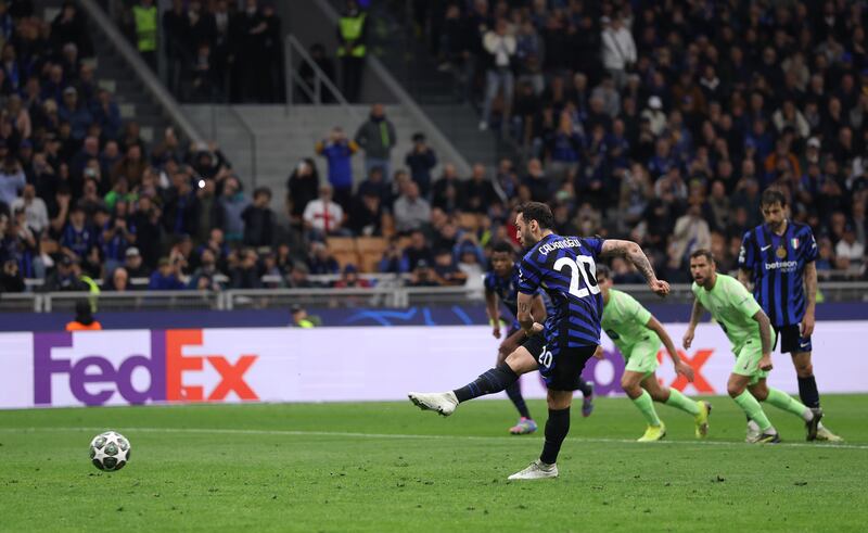 Hakan Calhanoglu scores Inter's second goal from the penalty spot for a half-time lead. Photograph: Carl Recine/Getty Images