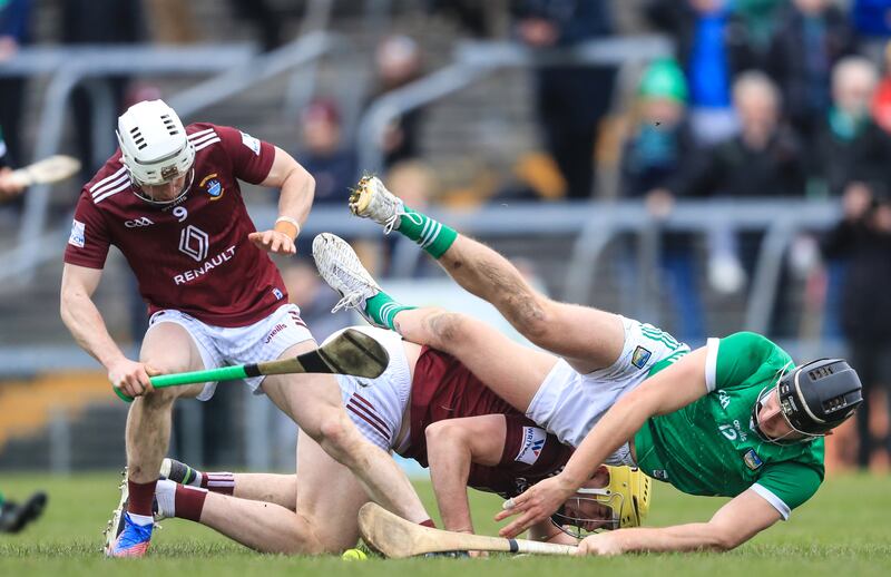 Limerick's Conor Boylan goes down with Killian Doyle of Westmeath. Photograph: Evan Treacy/Inpho