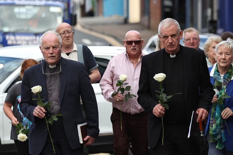 Rev Canon Robert Clarke (left) and Fr Eugene Hasson (right), the co-chair's of Omagh Churches' Forum join families at the memorial. Photograph: Liam McBurney/PA Wire