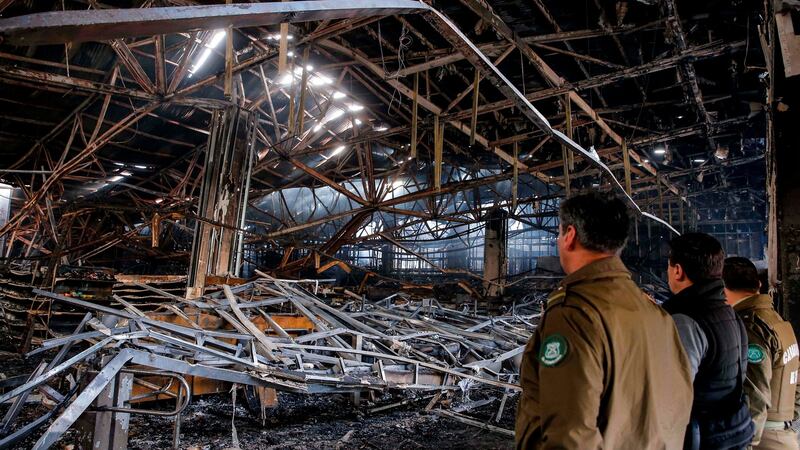 A burned out supermarket in Valparaíso, Chile. Photograph: Javier Torres/AFP via Getty