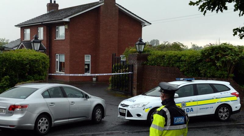Gardaí at a house where a woman was found dead with serious head injuries near Hackballscross, Co Louth. Photograph: Eric Luke