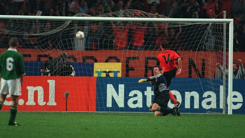 Roy Keane looks on as Jeffrey Talan’s diving header beats Ireland goalkeeper Alan Kelly during the World Cup qualifier at the Amsterdam Arena on September 2nd, 2000. Photograph: Lorraine O’Sullivan/Inpho