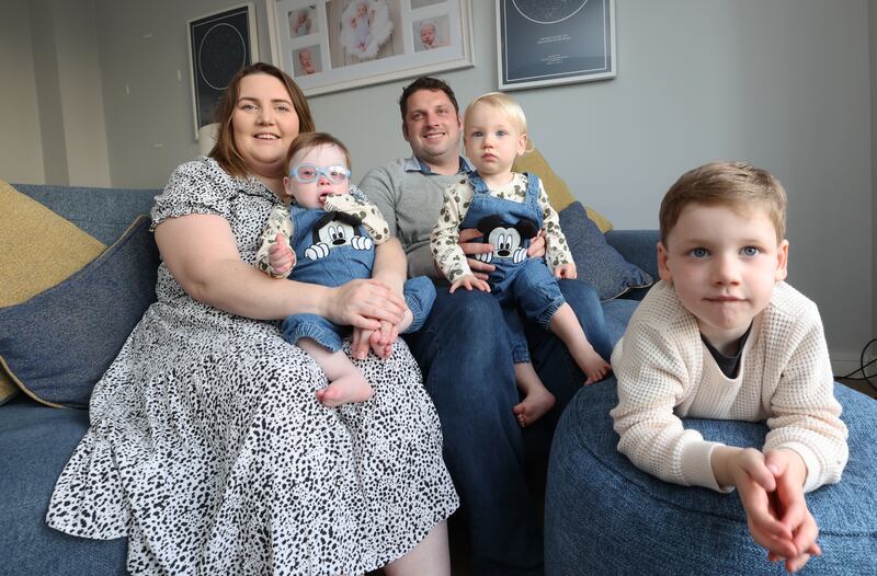 Tracy Holmes and her husband, Andrew, with one-year-old twins Freddie and Theo, and four-year-old son Harry.  Photograph: Nick Bradshaw