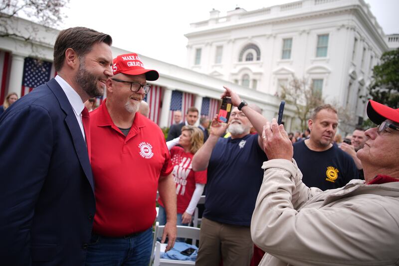 US Vice President JD Vance (L) poses for a photo with United Auto Workers (UAW) during a “Make America Wealthy Again” trade announcement event in the Rose Garden at the White House Photograph: Getty Images