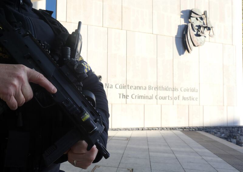 An armed garda outside the Criminal Courts of Justice in November for the murder trial of Gerard Hutch for the Regency Hotel murder of David Byrne. Photograph: Leah Farrell/RollingNews.ie